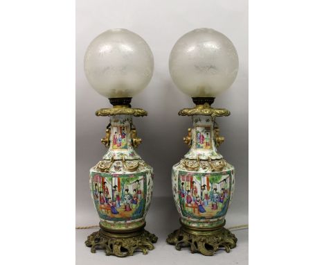 A GOOD LARGE PAIR OF 19TH CENTURY ORMOLU MOUNTED CANTON PORCELAIN VASES, fitted for electricity and with oil lamp fittings in