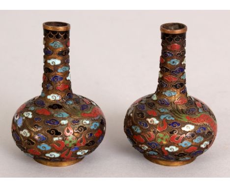 A PAIR OF 19TH/20TH CENTURY JAPANESE MINIATURE CLOISONNE DRAGON VASES, the enamel decoration reserved on an unfilled ground, 