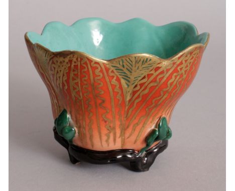 A CHINESE PORCELAIN LOTUS CUP, the interior glazed turquoise, the base with a Yongzheng seal mark, 2.8in high & 4in wide at w