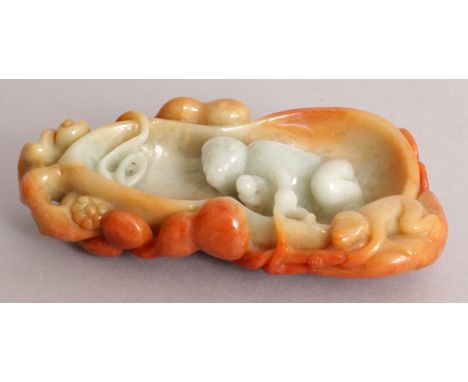 AN UNUSUAL CHINESE JADE GOURD FORM BRUSHWASHER, the interior decorated in high relief with a monkey, the sides with a smaller
