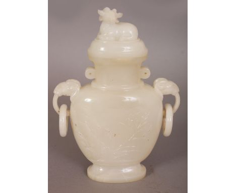 AN EARLY 20TH CENTURY CHINESE WHITE JADE LIKE VASE & COVER, with ram's head double loose ring handles, the sides with foliage