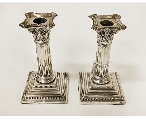 PAIR OF SILVER VINTAGE WEIGHTED CORINTHIAN CANDLESTICKS - 16 CMS (H) APPROX