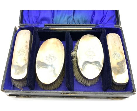 Pair of silver backed hair brushes matching clothes brushes and comb each engraved with a monogram and in fitted case Birming