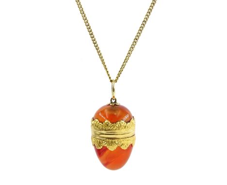 19th century 18ct gold mounted agate egg pendant, with hinged lid, on gold chain stamped 15c