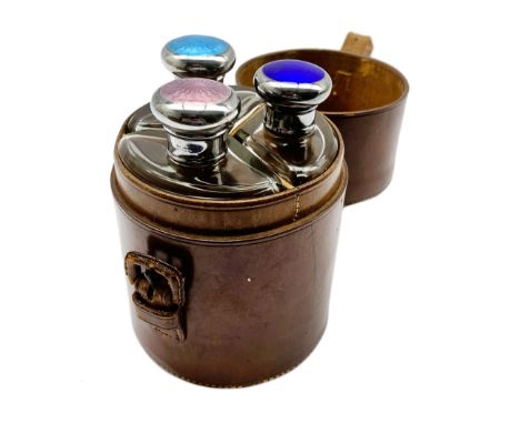 Set of three late Victorian glass spirit flasks with silver and coloured enamel tops, circular segment form London 1893 in le