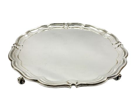 Silver circular salver with pie crust border on scroll feet D30cm London 1915 Maker Harrison Bros. and Howson  30.1oz