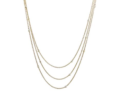 Long 16ct gold chain set with twenty light grey pearls