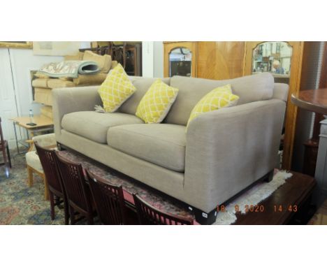 A three seater modern sofa, beige