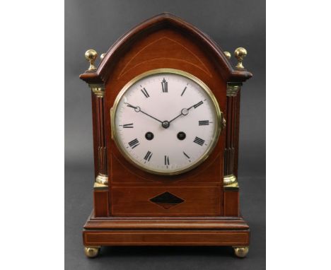 A Regency style mahogany boxwood strung brass mounted lancet top bracket clock, circa 1900, the white enamel dial with Roman 