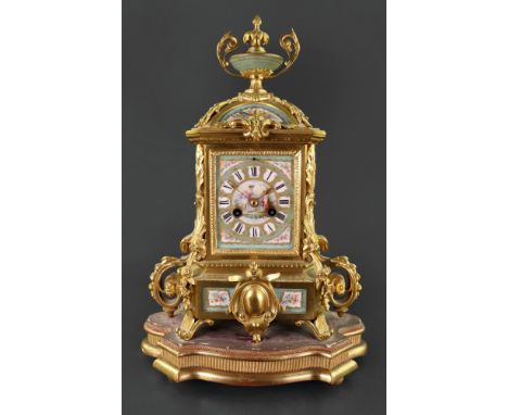 Edmonds Paris; an ornate gilt metal mantel clock, circa 1880, the rectangular case with a domed top surmounted by a classical