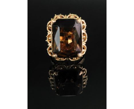 A topaz dress ring, the rectangular cut-cornered topaz measuring approximately 17.95mm x 13.14mm, approximate total weight 16