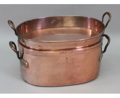 A Victorian oval copper pan, with twin brass side handles, stamped k 2, the pull-off cover also a pan, the pierced steel drai