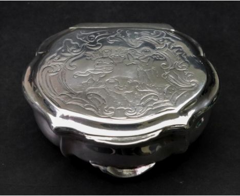 A Danish silver snuff box, Copenhagen, early 18th century, of shaped outline, the hinged cover engraved with figures, mask an