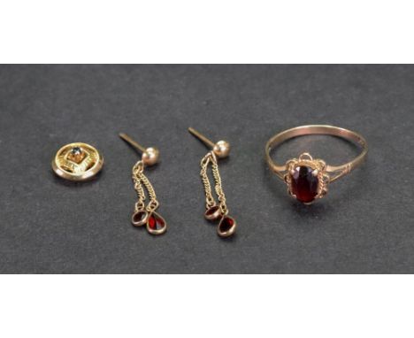 A gold and garnet set ring, ring size M, 1.3g gross, together with a pair of garnet drop earrings and a garnet pendant, 1.4g 