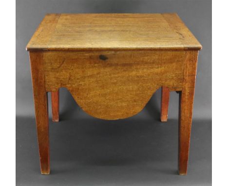 A George III mahogany commode, now adapted, the hinged top enclosing a compartment, having shaped aprons, on square tapered l