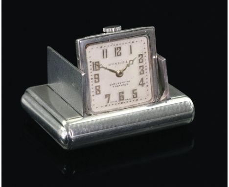 Dunhill; a silver miniature travel clock, the engine turned case with hinged divided doors enclosing the clock, the dial with