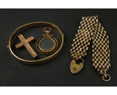 A 9ct gold cuff bracelet, with a 9ct gold heart shaped padlock, Birmingham 1900, together with a 9ct gold cross pendant, 27.2