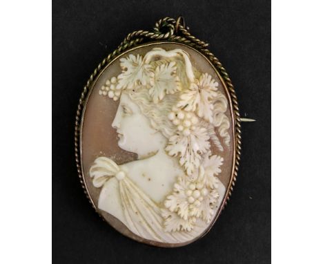 An oval shell cameo brooch carved with a portrait of Bacchus, the mount detailed with a ropetwist border, fitted with a safet