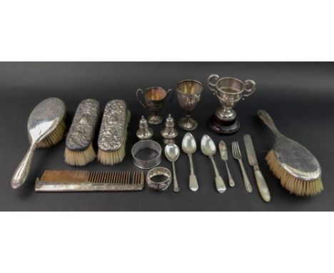 A pair of Victorian silver mounted clothes brushes, A & J Zimmerman, Birmingham 1896, heavily foliate embossed, a pair of sil