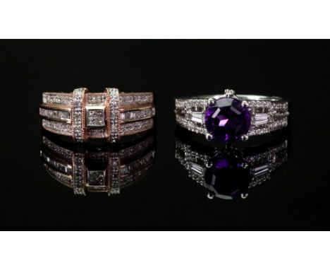 An 18ct white gold amethyst and diamond-set dress ring set with a circular-cut amethyst four claw set and circular and baguet