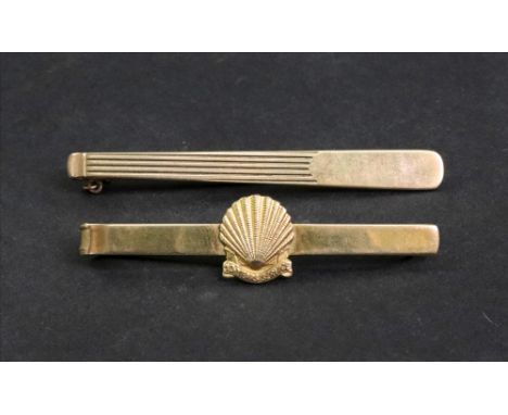 A 9ct gold tie clip, Birmingham 1992, 10 years service at Shell, another 9ct gold engine turned tie clip, Birmingham 1958, 12