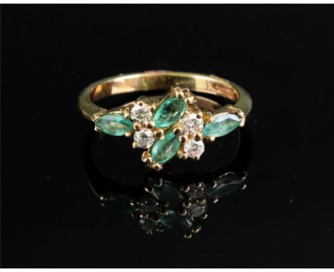 An 18ct gold, emerald and diamond-set dress ring of cluster design set with marquise-cut emeralds and circular-cut diamonds i