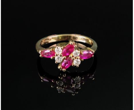 An 18ct gold, ruby and diamond-set dress ring of cluster design set with marquise-cut rubies and circular-cut diamonds in a l