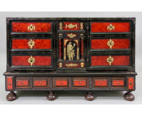 A late 17th century Flemish ebony cedar and tortoiseshell veneered table cabinet, of breakfront outline, the central architec