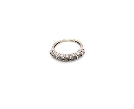 A 9ct HALLMARKED WHITE GOLD SEVEN STONE DIAMOND HALF ETERNITY RING. FINGER SIZE K. WEIGHT 2.2grms. 