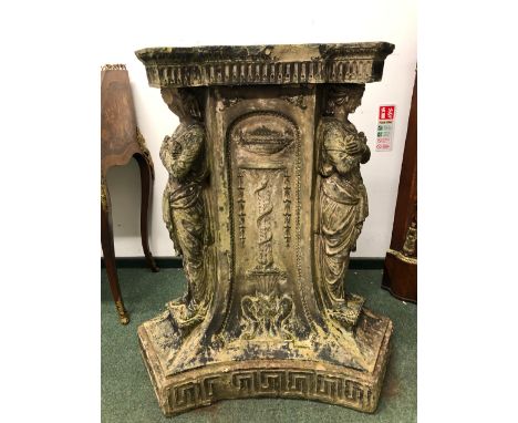 A ANTIQUE COADE STONE SUNDIAL PEDESTAL, THE TRIANGULAR TOP ABOVE CLASSICAL FIGURES STANDING AT EACH CORNER FLANKING URNS ON S