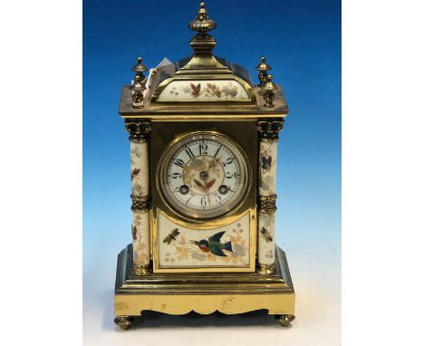 A PORCELAIN AND BRASS CASED JAPY FRERES CLOCK STRIKING ON A COILED ROD, THE COLUMNS, CIRCULAR DIAL, PANELS ABOVE AND BELOW PA