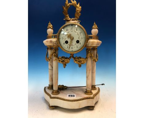 AN ORMOLU MOUNTED FOUR COLUMN PORTICO CLOCK, THE ENAMEL DIAL WITH FLORAL SWAGS BETWEEN THE ARABIC NUMERALS, THE MOVEMENT WITH