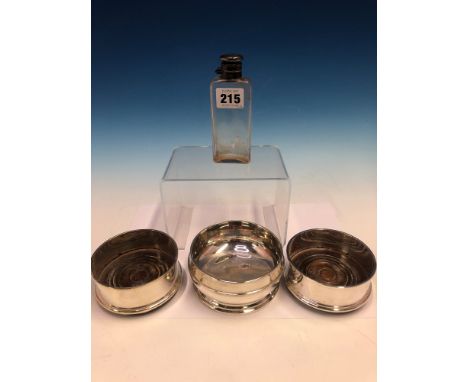 A PAIR OF HALLMARKED SILVER SMALL WINE COASTERS WITH MAHOGANY BASES TOGETHER WITH A SMALL SILVER BOWL AND A DIXON GLASS FLASK