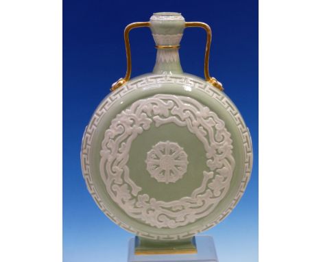 A ROYAL WORCESTER TWO HANDLED MOON FLASK, THE PALE GREEN CELADON BODY OVER DECORATED IN WHITE WITH FOLIATE ROUNDELS AND CENTR