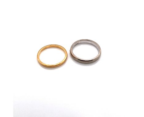 A 22ct YELLOW GOLD VINTAGE WEDDING BAND TOGETHER WITH An 18ct HALLMAKRED WHITE GOLD WEDDING BAND. FINGER SIZE BOTH L1/2. 22ct