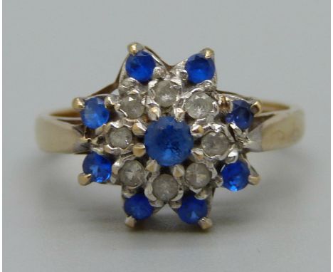 A 9ct gold, blue and white stone cluster ring, 3.3g, O 