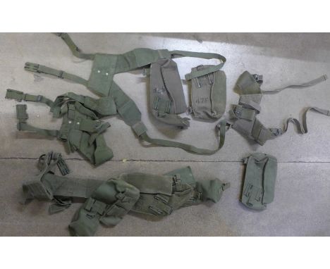 Six British Army 58 pattern webbing, comprising three right hand and three left hand ammunition pouches, and four yokes 
