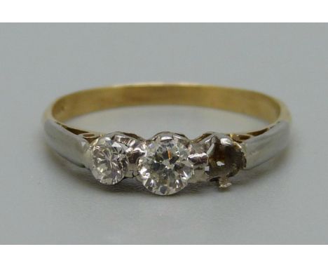 An 18ct gold and diamond ring, marked 750, one diamond missing, 1.6g, L 