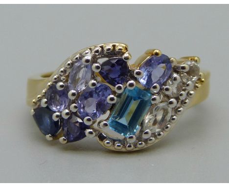 A silver gilt, tanzanite, topaz, iolite and zircon ring, N 