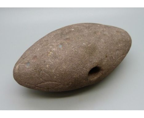 A North American Indigenous axe head, circa 1926 