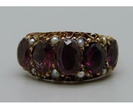 A Victorian 9ct gold, almandine garnet and pearl ring, 2.1g, M 