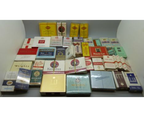 A collection of vintage cigarette packets with contents 