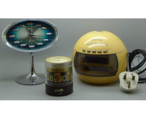 Three clocks, one digital alarm clock, a Japanese alarm clock and a Waltham Time Machine 