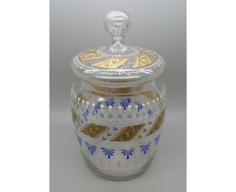 A glass biscuit barrel with enamel design 