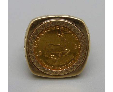 A 1985 1/10th oz. fine gold Krugerrand coin set in a 9ct gold ring, 8.4g total weight, (22ct gold coin 3.3g and 9ct gold ring