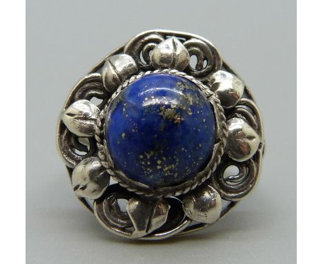 An Arts and Crafts silver ring set with lapis lazuli, attributed to Sybil Dunlop, M 