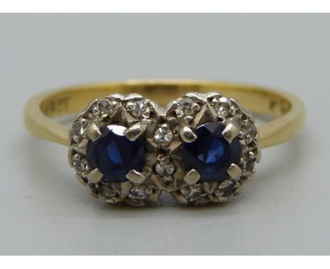 An 18ct gold, sapphire and diamond double cluster ring, 3.5g, O 