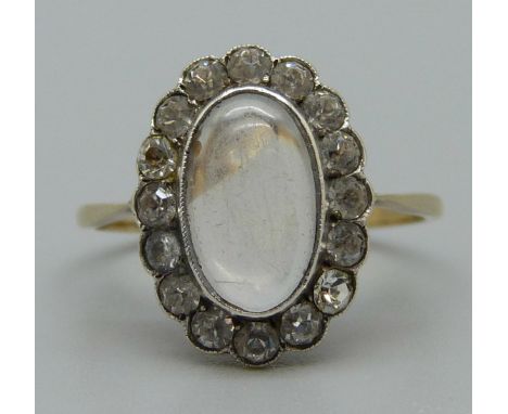 A 9ct gold and silver galleried Arts and Crafts ring set with moonstone and white sapphires, M 