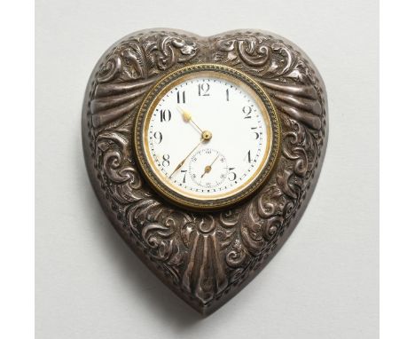 A VICTORIAN SILVER HEART SHAPED WATCH CASE, decorated with scrolls. 3.5ins x 3ins.  Birmingham 1897.  Maker: D. C. &amp; Co.