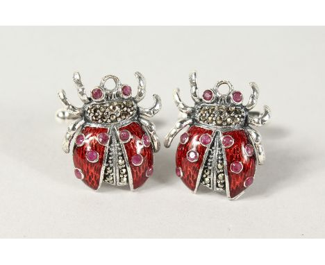 A PAIR OF SILVER AND ENAMEL RUBY SET LADYBIRD CUFFLINKS.